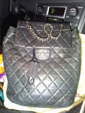 CHANEL Black Quilted Leather Backpack with Chain-Detail Straps